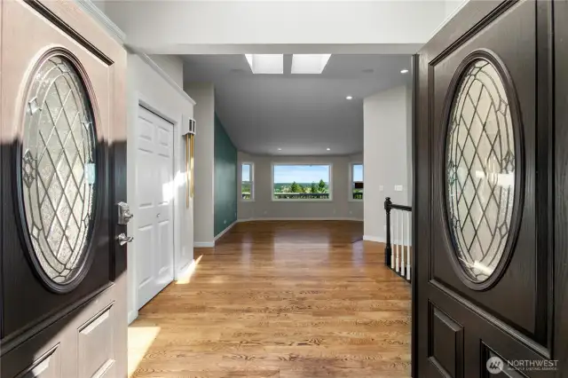 French doors open to large and bright entryway