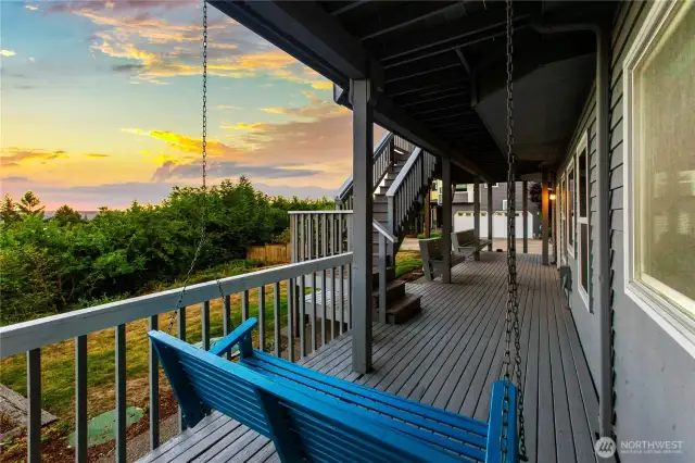 Downstairs deck area with porch swing