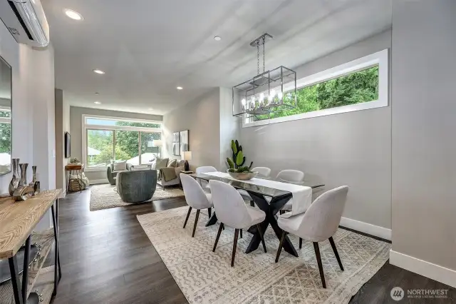 Great room filled with natural light and tranquil end of building setting.