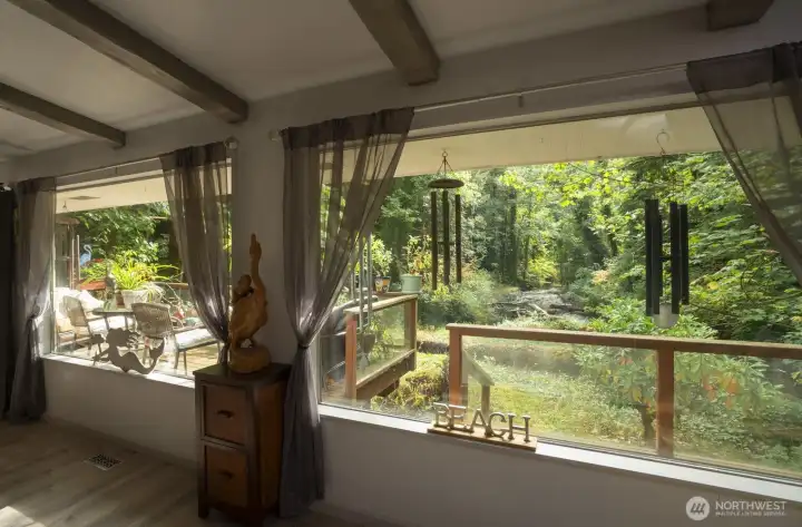 huge Livingroom windows overlooking the river and creek merging