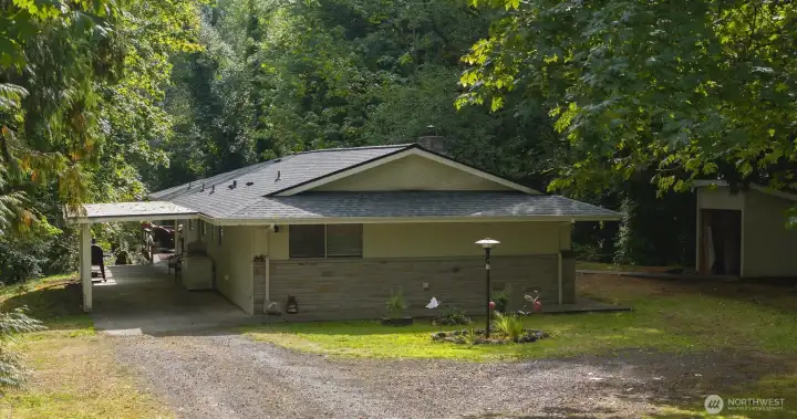 side of home with carport, 3 year old roof