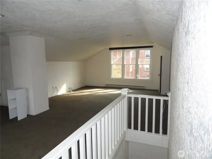 Upstairs room.  Could be a great room or primary bedrood