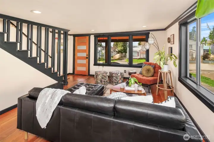The inviting and chic living room is beyond fabulous! Such charming design features that marry perfectly with the original features of the home. So much light in this gorgeous space!