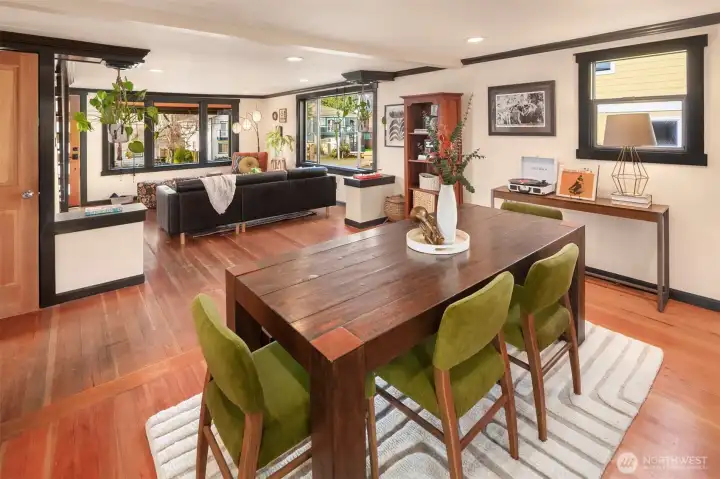 The dining space sits open with the living room and kitchen- perfection!