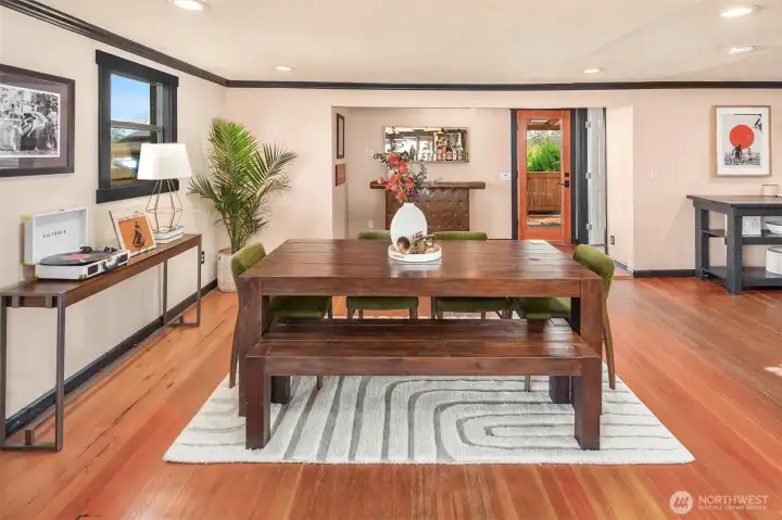 Another view of you large dining room. Note the open door just next to the back door, that is one of three bathrooms!