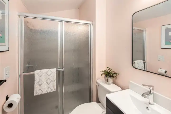 The main floor full bathroom behind the kitchen. Really easy to pop into from outside, so convenient!