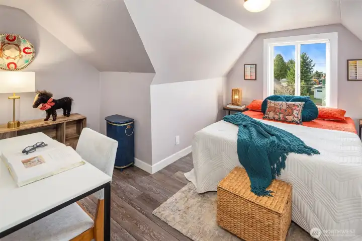 The second bedroom upstairs is incredibly charming, with tons of great space.