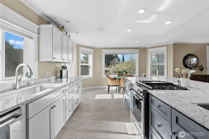 This kitchen has so much cabinetry, counter space and storage plus a gas range