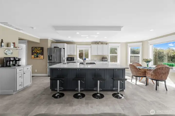 Kitchen has an abundance of storage, beautiful cabinetry and a walk-in pantry