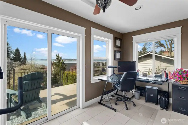 This bonus room off the primary is perfect for office & gym with gorgeous views.