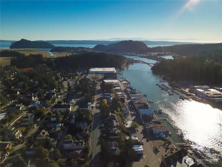 Arial View of La Conner, Rainbow Bridge and Shelter Bay Community and Marina upper right.