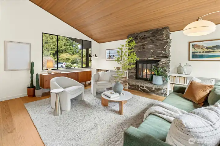 The main living room, like the rest of the living spaces, has new wide-plank engineered wood flooring.