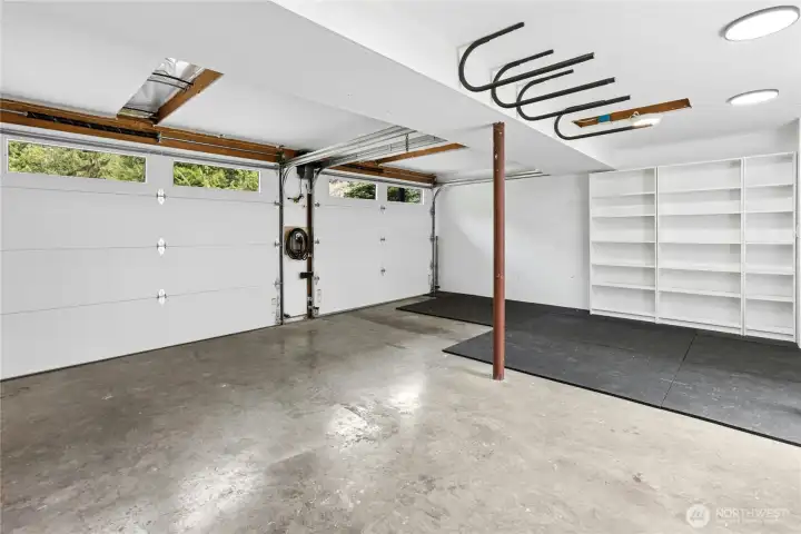 The two-car garage was fully finished and has two new insulated garage doors with auto-openers. There is also an EV charger and nice storage cabinetry.