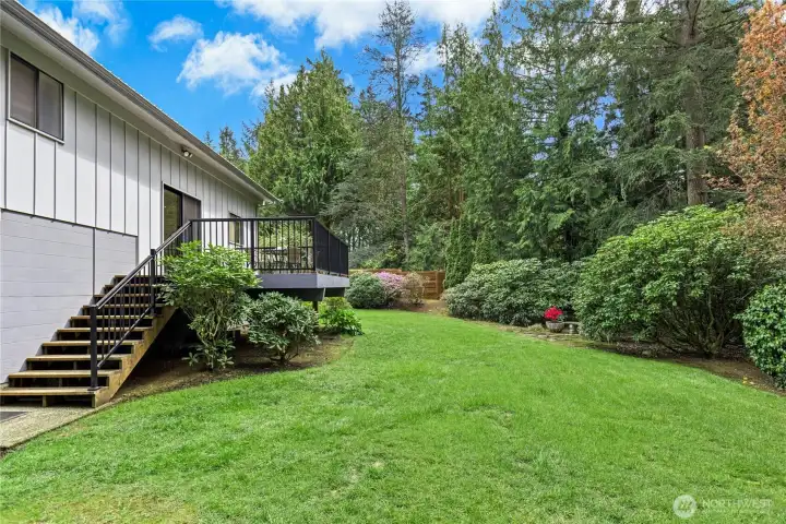 Ample flat grassy area for gardening or play.