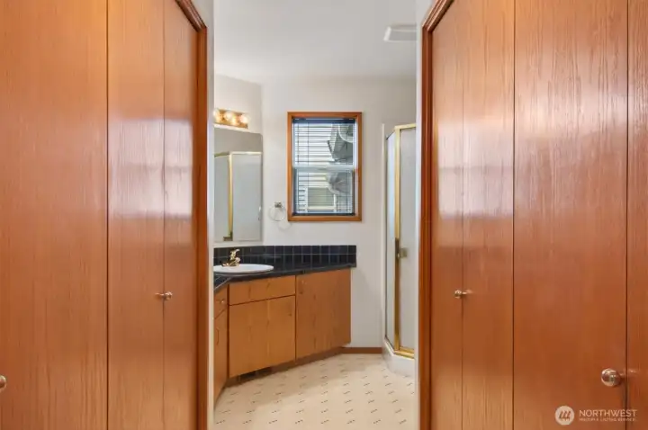 Main floor bathroom with laundry area in closet