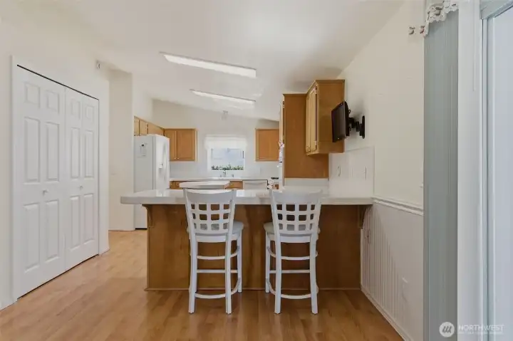 Breakfast bar and pantry storage. Sliding door on your right leads to your covered patio