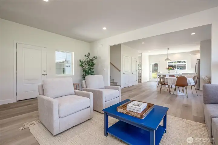 Living room open to dining and kitchen