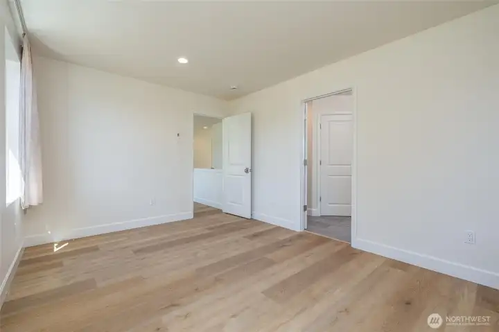 Master bedroom, door to bathroom on right