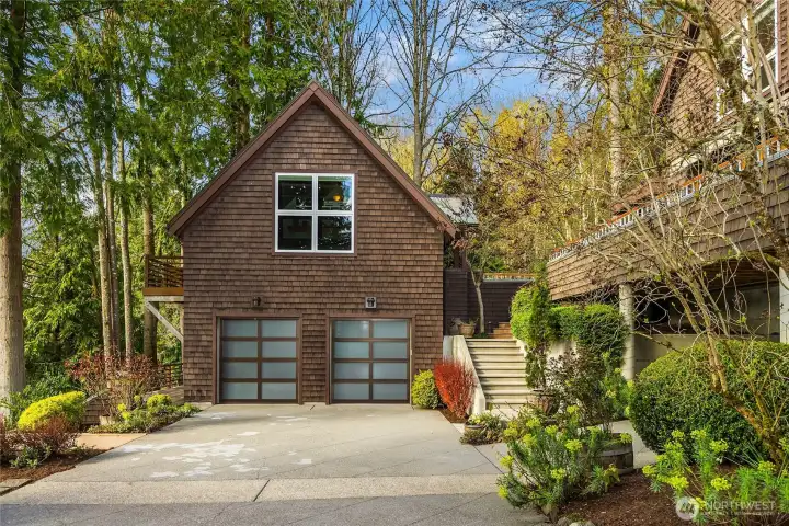 Two car garage with excellent storage and extra parking.