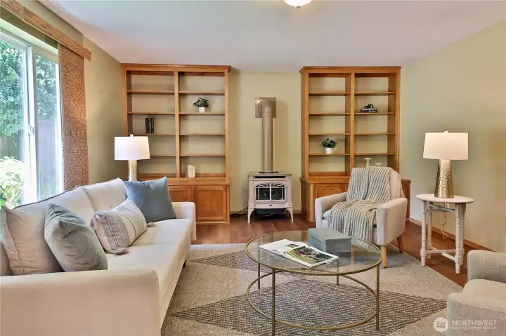 Cozy family room with built-in shelves and a propane stove. Cozy family room with built-in shelves and a propane stove.