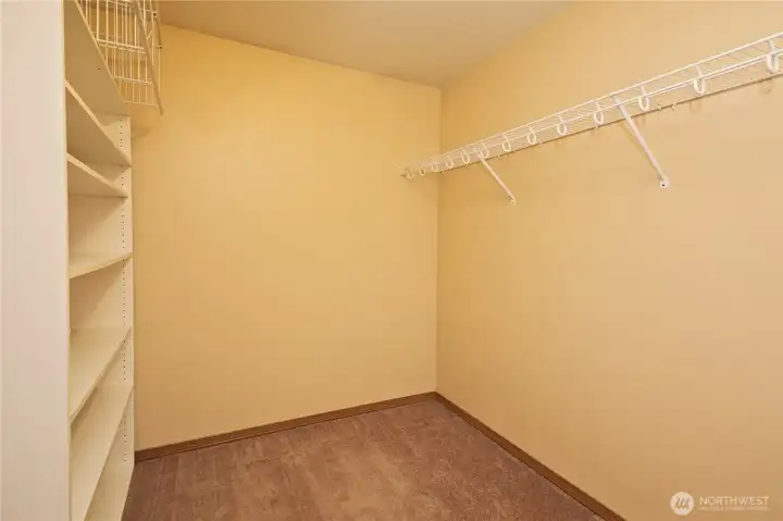 Primary walk-in closet Primary walk-in closet
