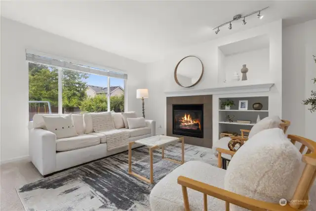 Bright family room with gas fireplace.