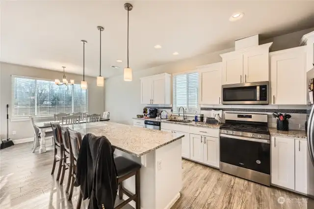 Large kitchen with gas stove.