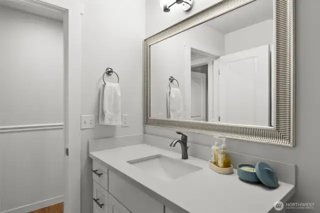 Quartz countertops and beautiful mirror