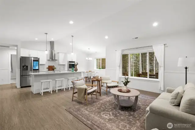 Imagine entering into this everyday. Stunning vaulted ceilings make this room seem so large with an open living concept!