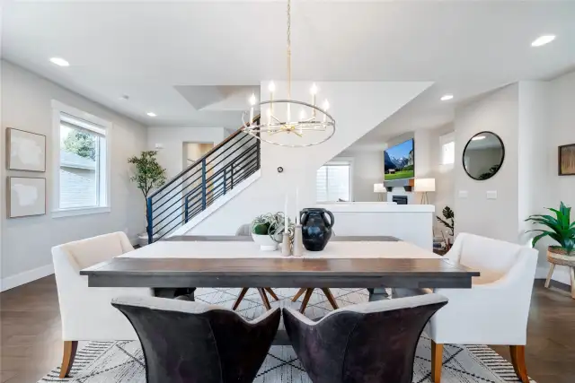 The well-appointed dining with a designer chandelier.