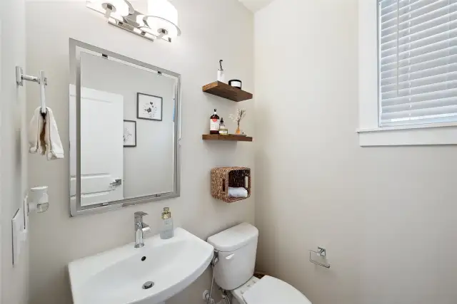 Powder bath on the first floor, off of the cozy living room.