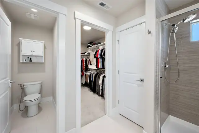 Walk-in closet with the primary bedroom.