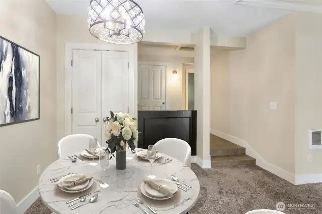 View of Dining Room and tiled entry with bench cubby and storage closet