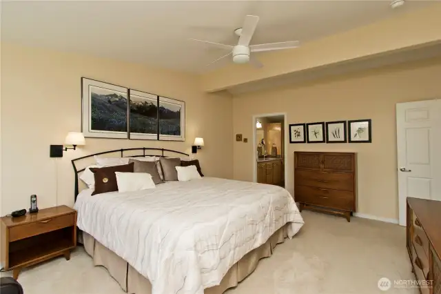 Light and airy primary bedroom offers a calm inviting retreat