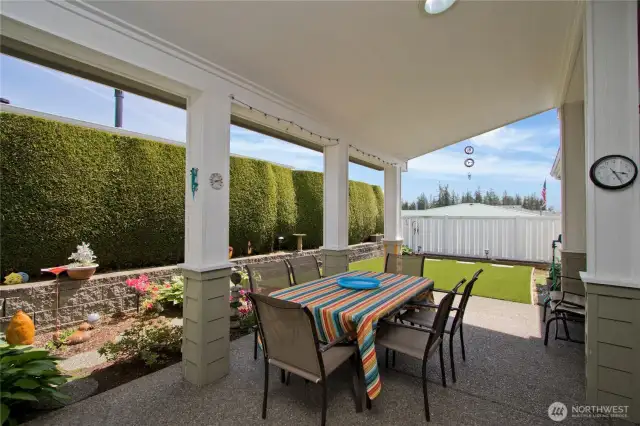 Delightful back patio with a covered porch