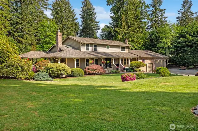 Park-like grounds, mature trees & shrubs.