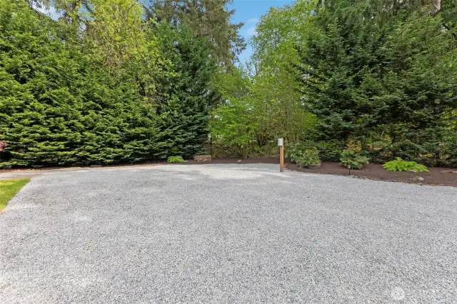 Huge gravel RV parking area with power hook-up.