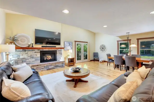 Great Room with gas fireplace & custom built stone & mantel.