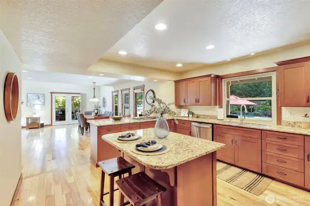 Large island with seating, power & cabinet storage.