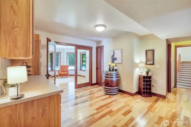 Hallway off kitchen with access to the back bar & sun room.