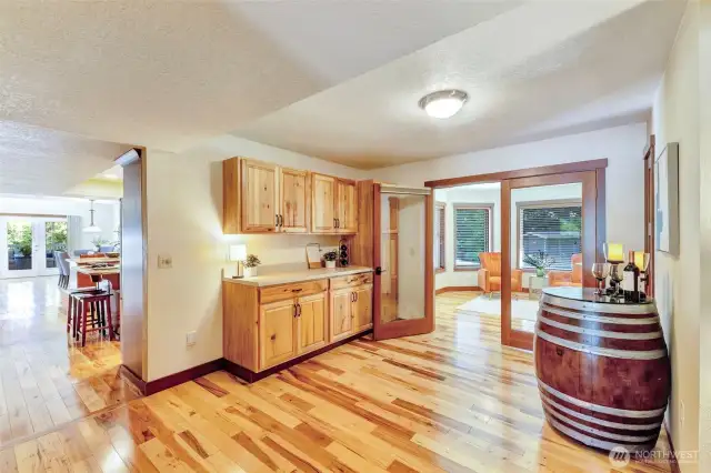 Additional kitchen storage, pantry overflow, back bar area.