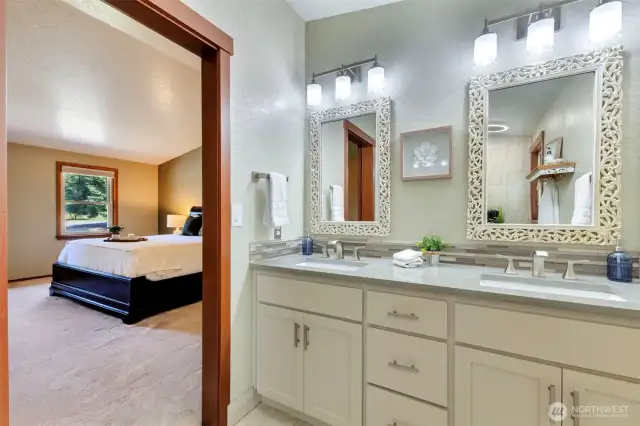 Primary bathroom recently updated with all new flooring, double sink vanity, shower, toilet, mirrors, lighting, sound system & barn door.