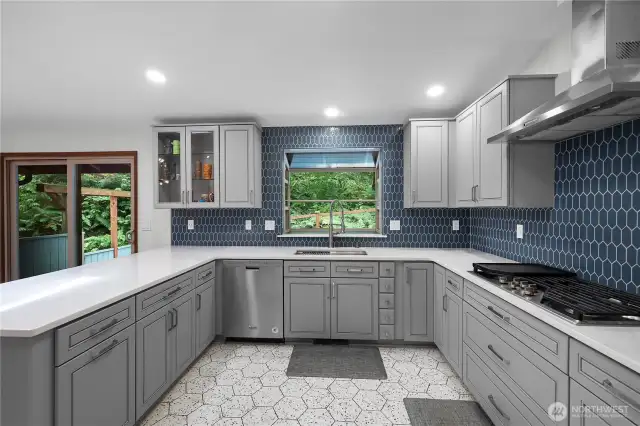 This welcoming eat-in kitchen looks through a garden window to the peaceful back yard which backs to an undeveloped park!