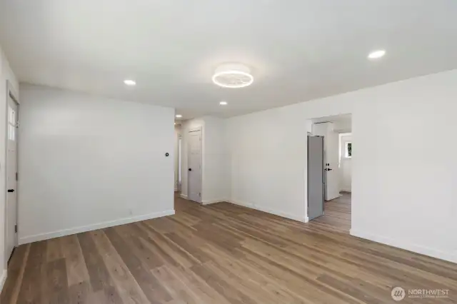 View from the living room to kitchen and hallway to the office and the bedrooms.