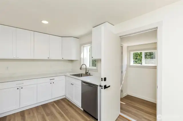 Just off the kitchen is the laundry/ mudroom from the back yard entrance.