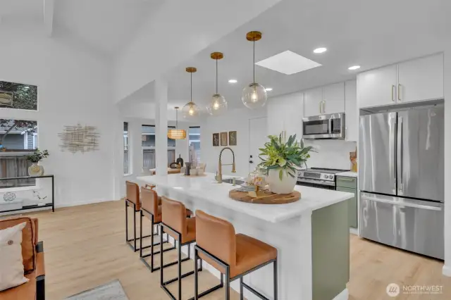 Recent updates include fresh paint, new flooring, modern lighting, stainless appliances, quartz countertops and custom cabinetry throughout.