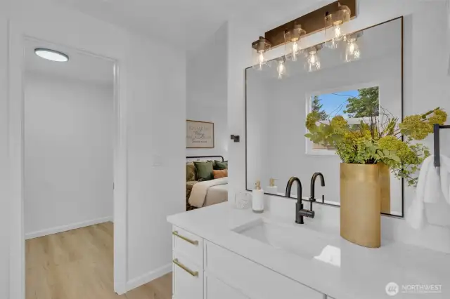 The bathroom connects directly to the primary bedroom, creating a convenient private suite layout.