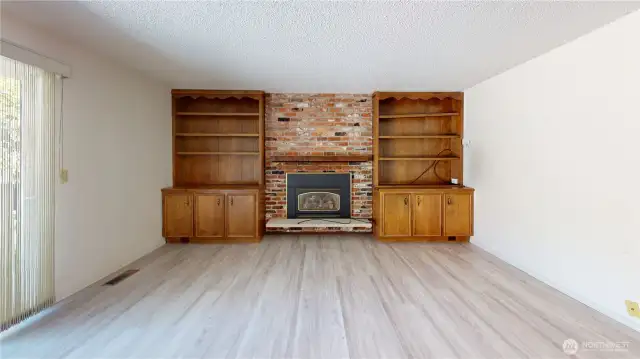 Living room features a view of the golf course  and access to a large deck and back yard.