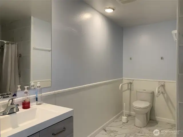 Main bath located on main floor with roll-in shower.
