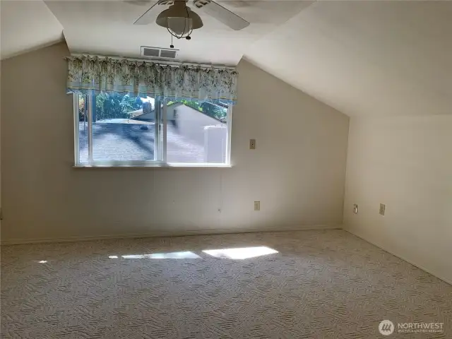 7th bedroom with ceiling fan, walk-in closet and easy bathroom access located on the second floor.